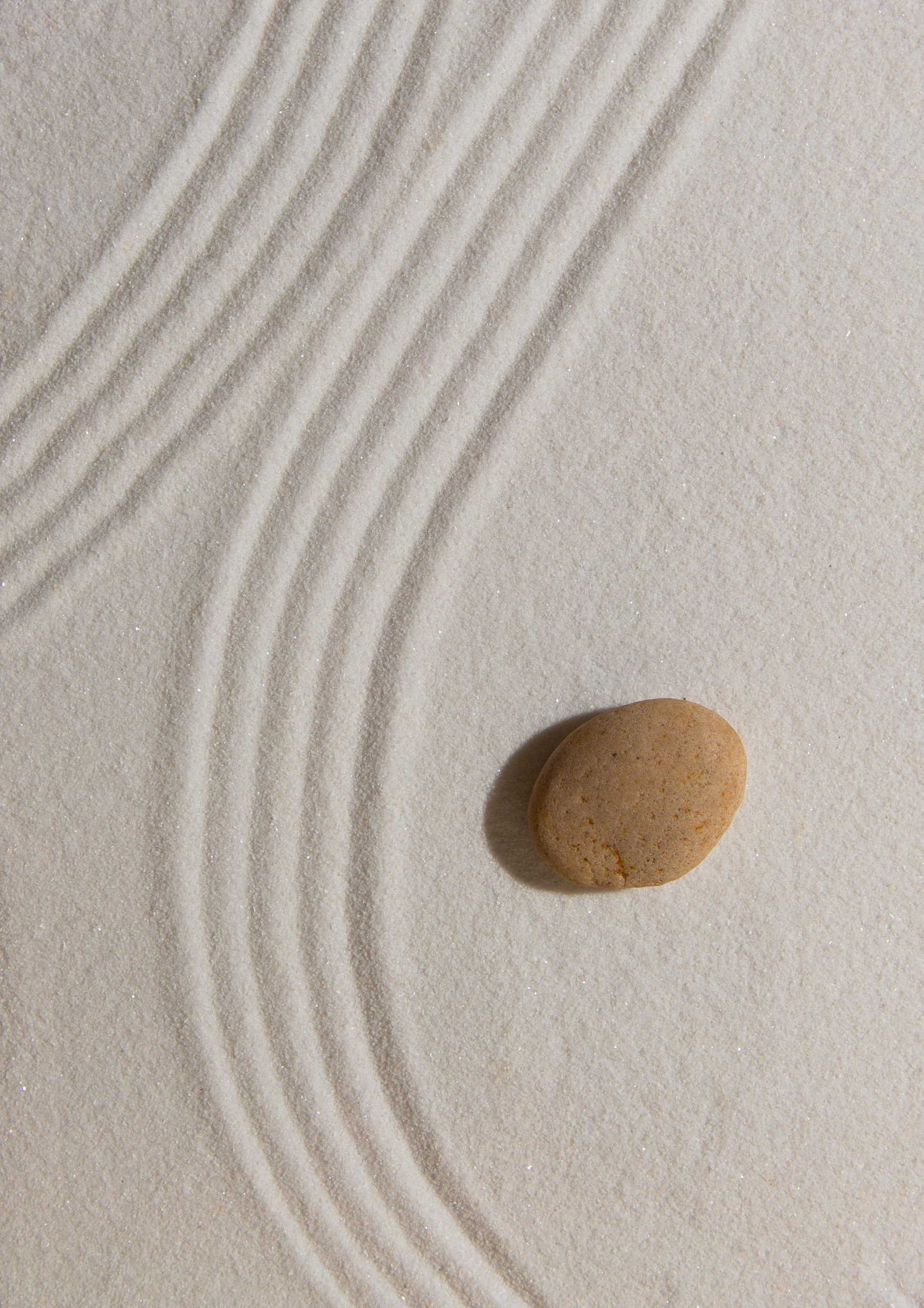 Pebble on Sand Flatlay